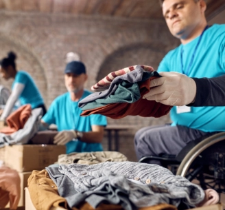 a man preparing clothes for donation